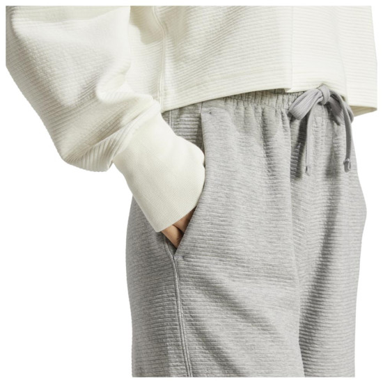 Adidas Γυναικείο παντελόνι φόρμας All SZN Rib 7/8-Length Wide-Leg Pants